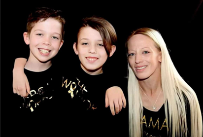 Photo of two boys and a woman.